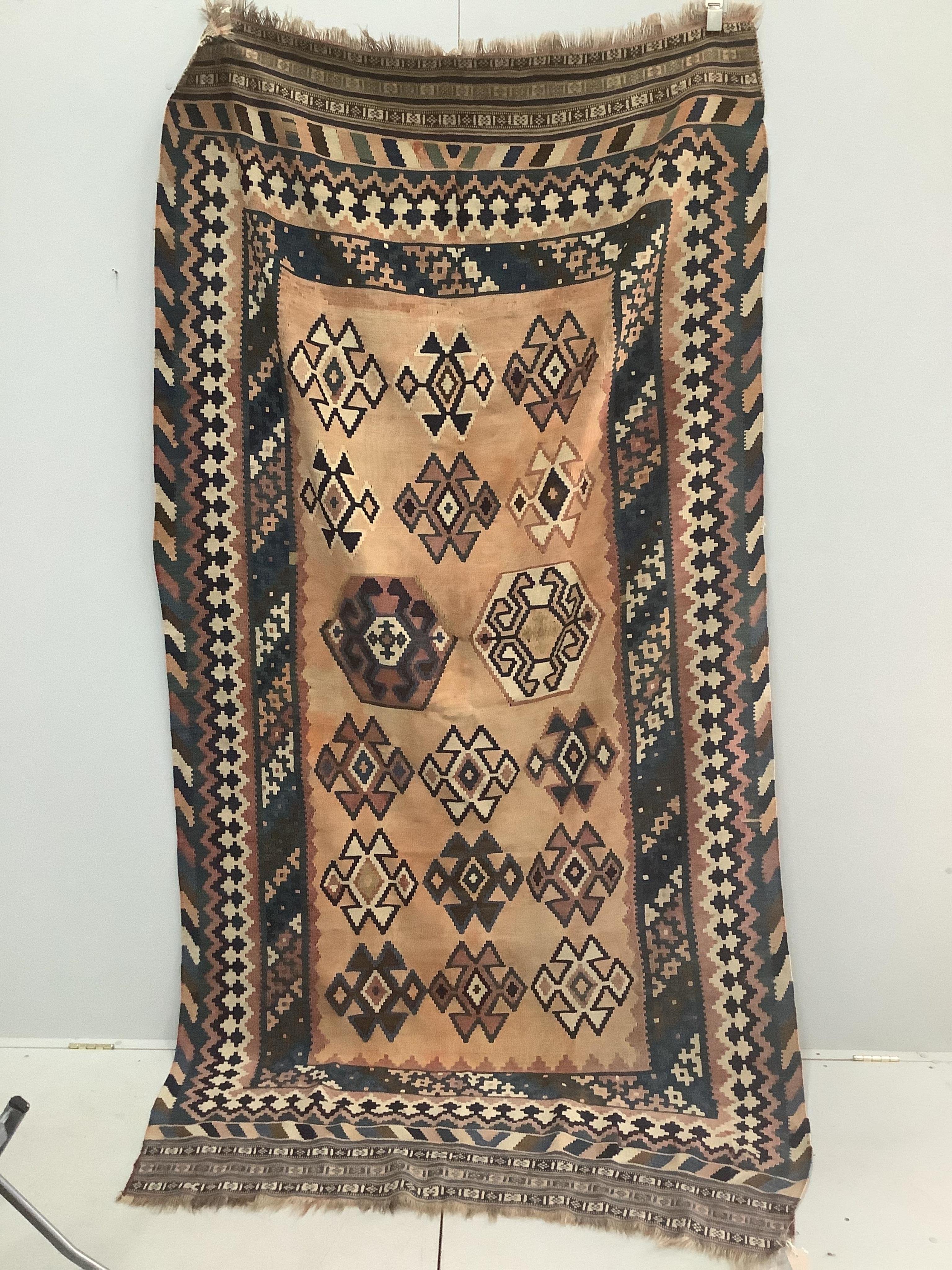 A Kilim polychrome flatweave rug, approximately 280 x 150cm. Condition - fair